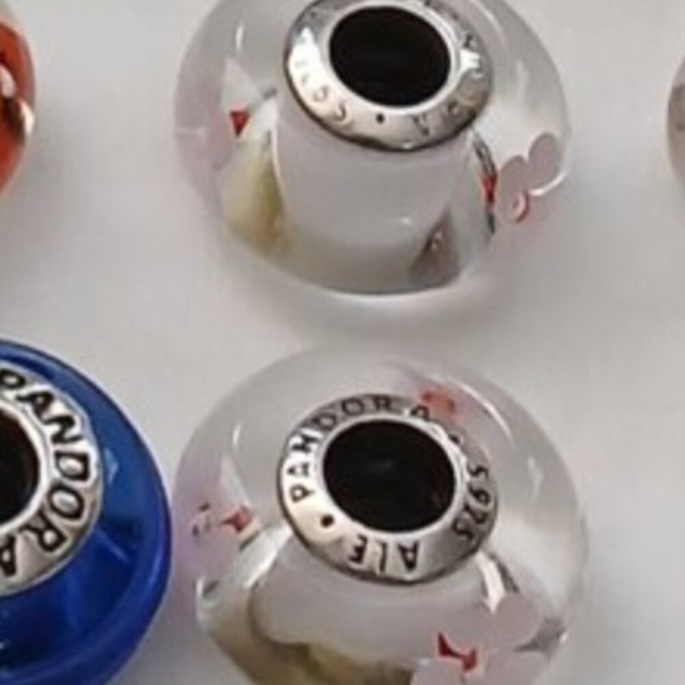 Pandora  cherry blossom muranos (2) and one pink with cz hearts.